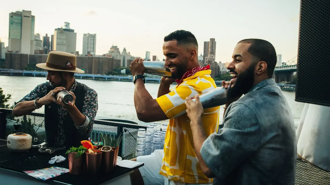 Bartender pouring with the bridge backdrop