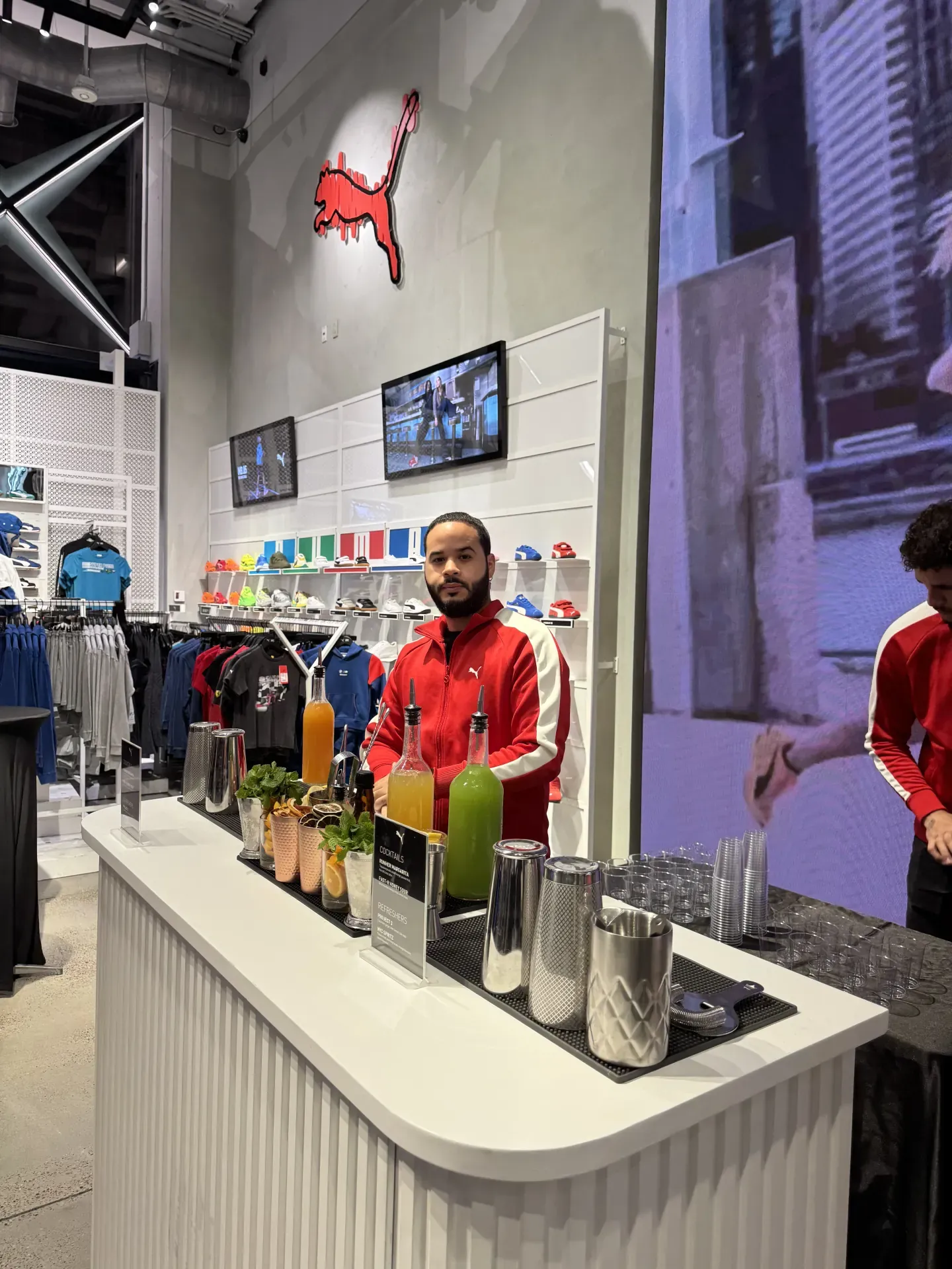 A WOA bartender running a custom mobile bar at the Puma flagship store activation